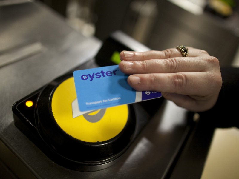 A passenger uses an oyster card to exit Liverpool Street station after traveling on a London Underground tube train in London, U.K., on Thursday, June 7, 2012. U.K. Sport, a provider of state funding to the country's Olympics program, has recruited about 100 companies and 25 academic institutions to adapt industrial technology for use in sports, according to Scott Drawer, the agency's head of research and innovation. Photographer: Simon Dawson/Bloomberg via Getty Images